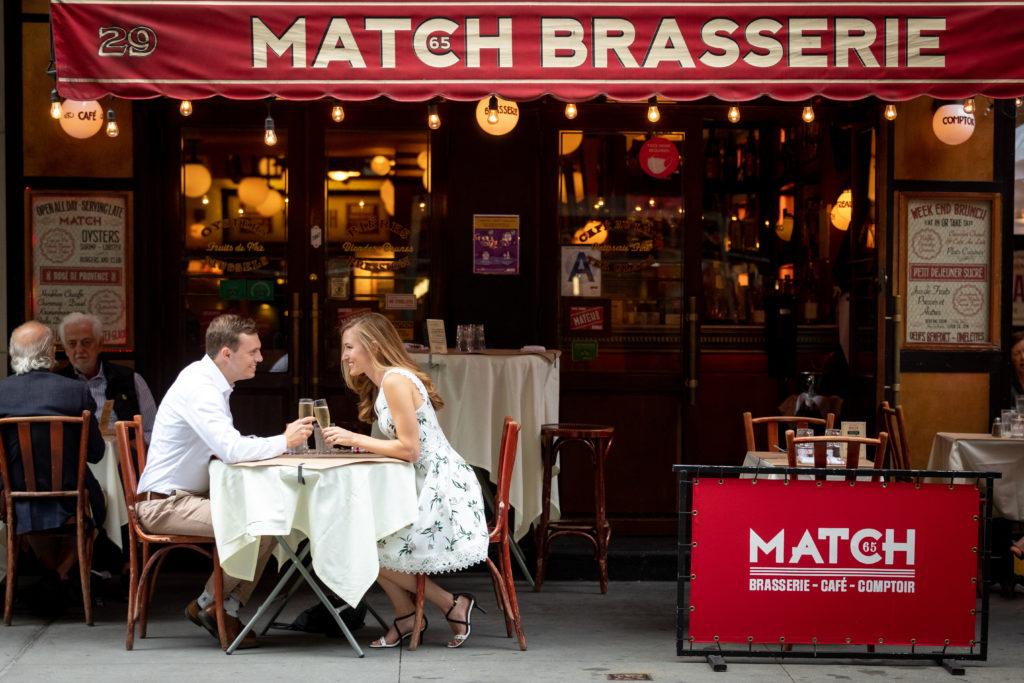 Couple dining outdoors in Manhattan at a Upper Eastside restaurant, Match Brasserie