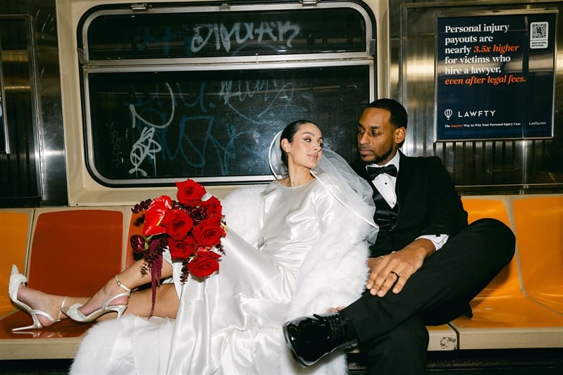 Chic couple on the NYC subway on their wedding day with direct flash.